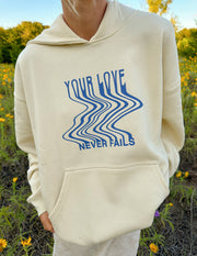 Love Never Fails Cream Unisex Hoodie Christian Sweatshirt