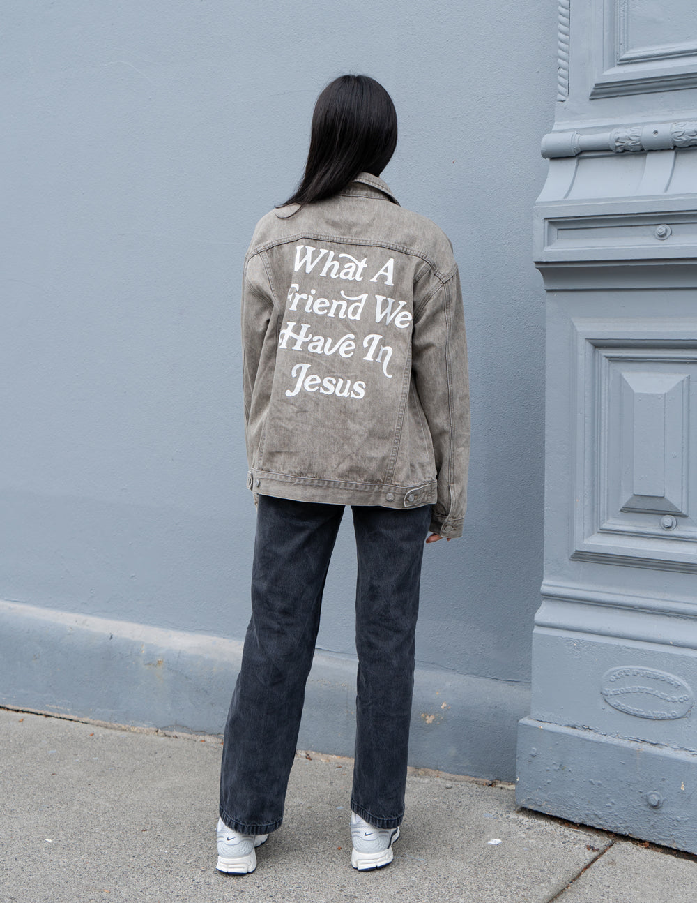 Denim jacket with sales writing on back