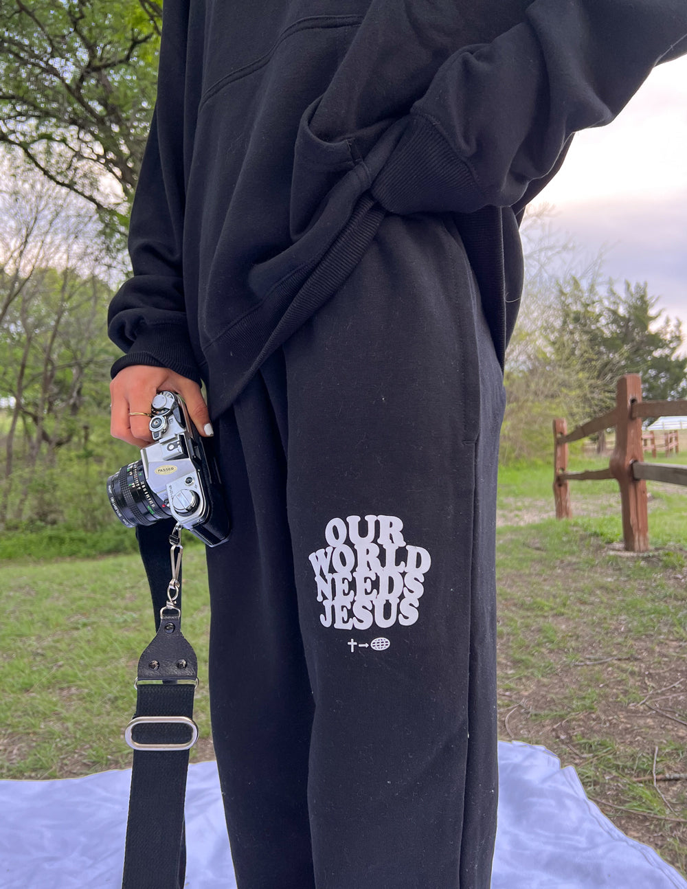 Our World Needs Jesus Black Unisex Sweatpant | Elevated Faith